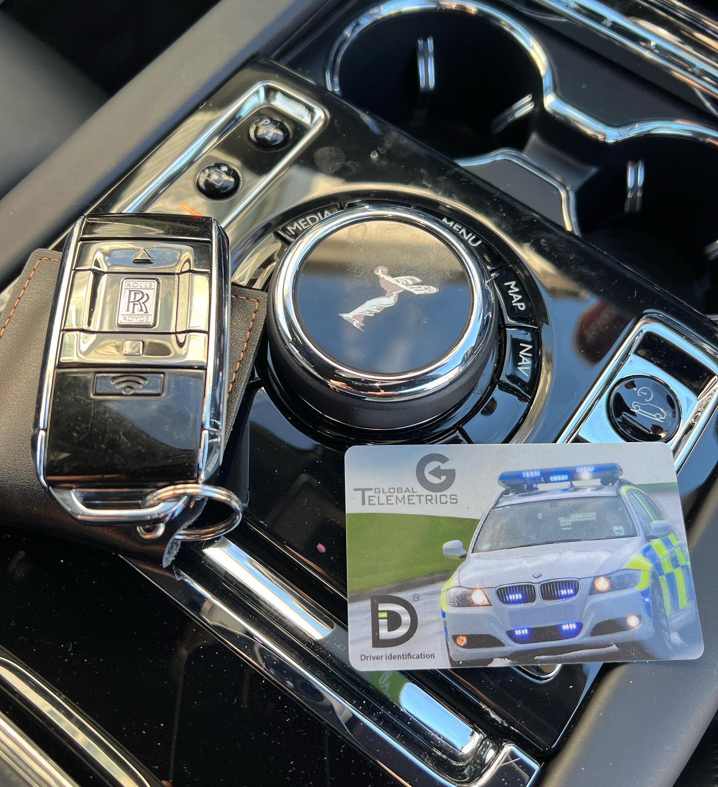 Rolls Royce Tracker centre console of Rolls Royce with keys and recognition card