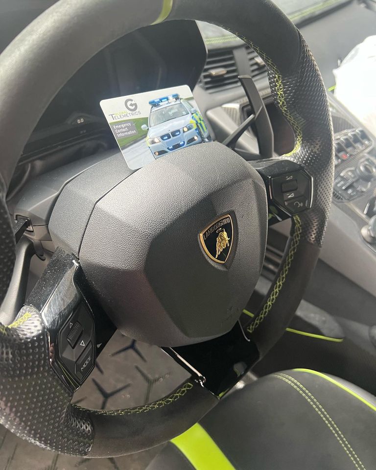 Lamborghini Tracker Steering wheel of Lamborghini with recognition card from a tracker